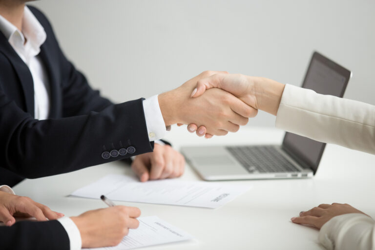 Hr handshaking successful candidate getting hired at new job, cl